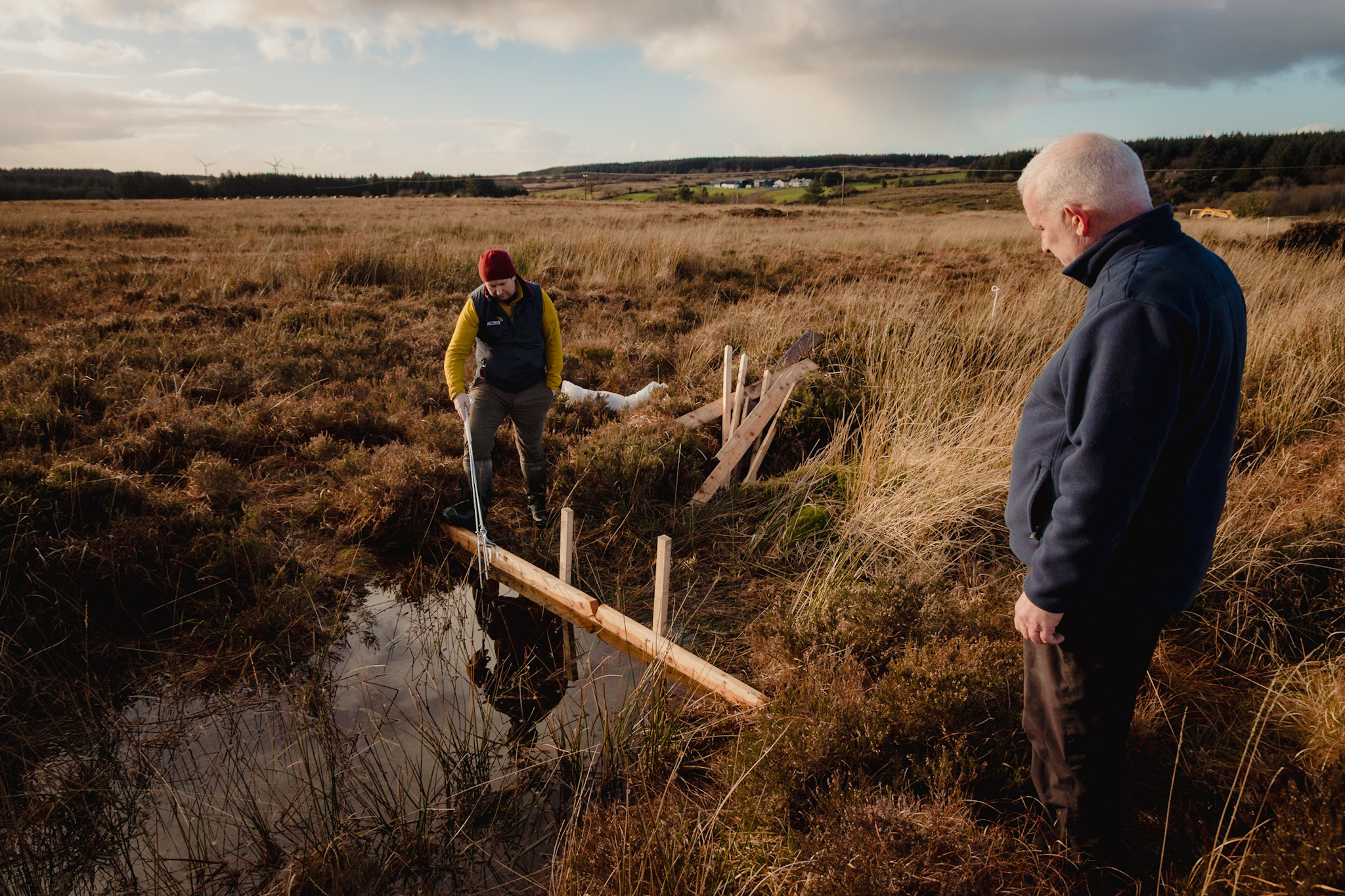 Two people at dam installation site